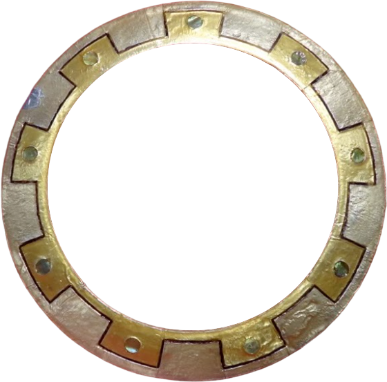 Xena's fabled weapon, the Chakram, a circular metal throwing blade painted with a simple pattern.
